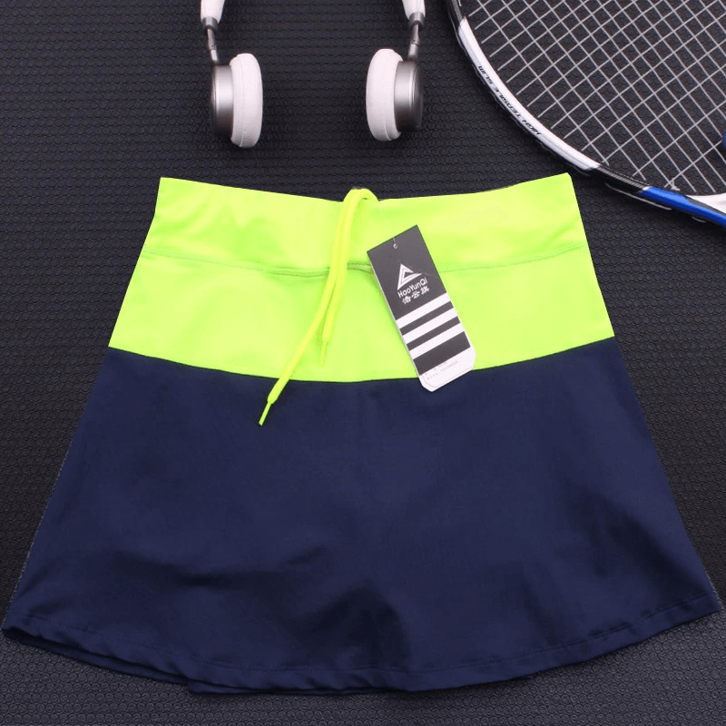 Women's breathable tennis skirt-shorts in navy and neon yellow with pocket, perfect for tennis, running, and fitness activities.